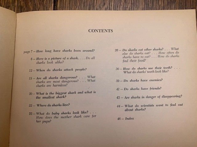Sharks book by Ann McGovern. 47 pages. Scholastic Book services. Copyright 1976